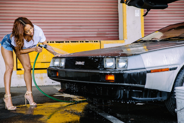 Karrueche Tran washing a DeLorean