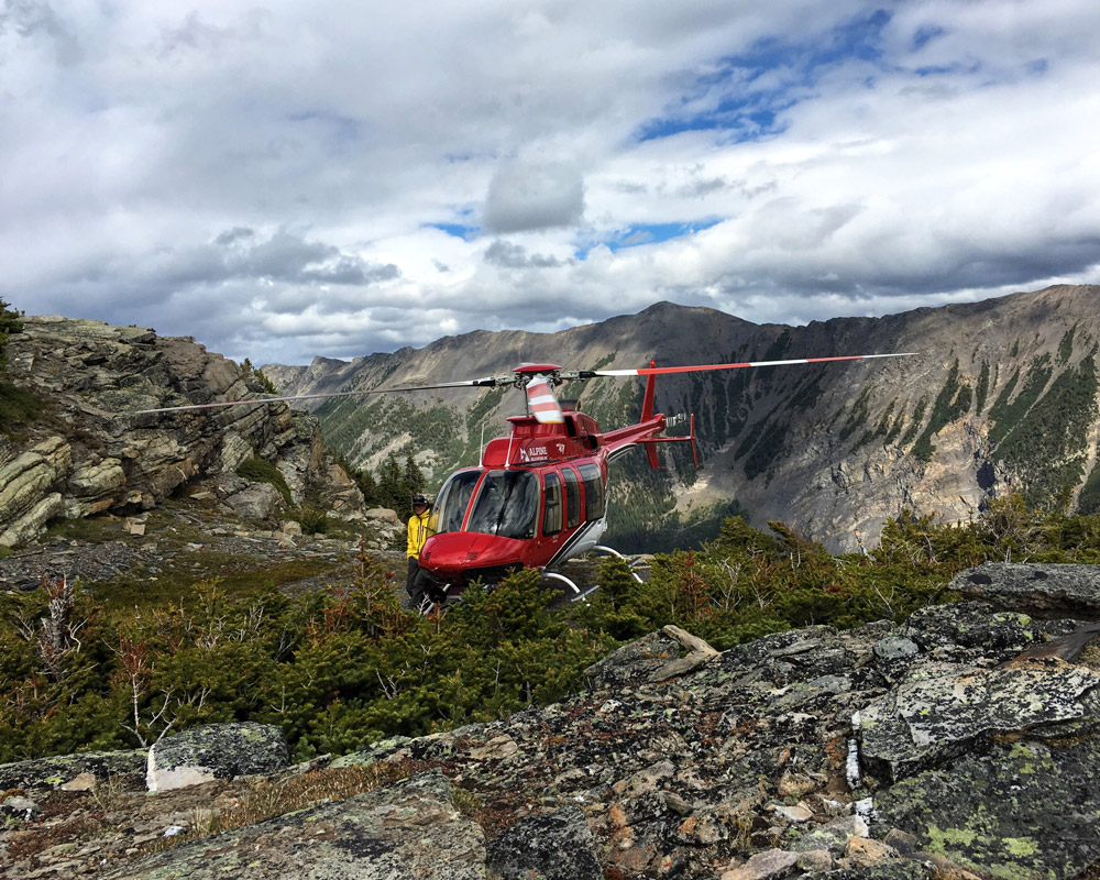 CMH Heli Pickup at the Top of the Conrad Glacier Hike